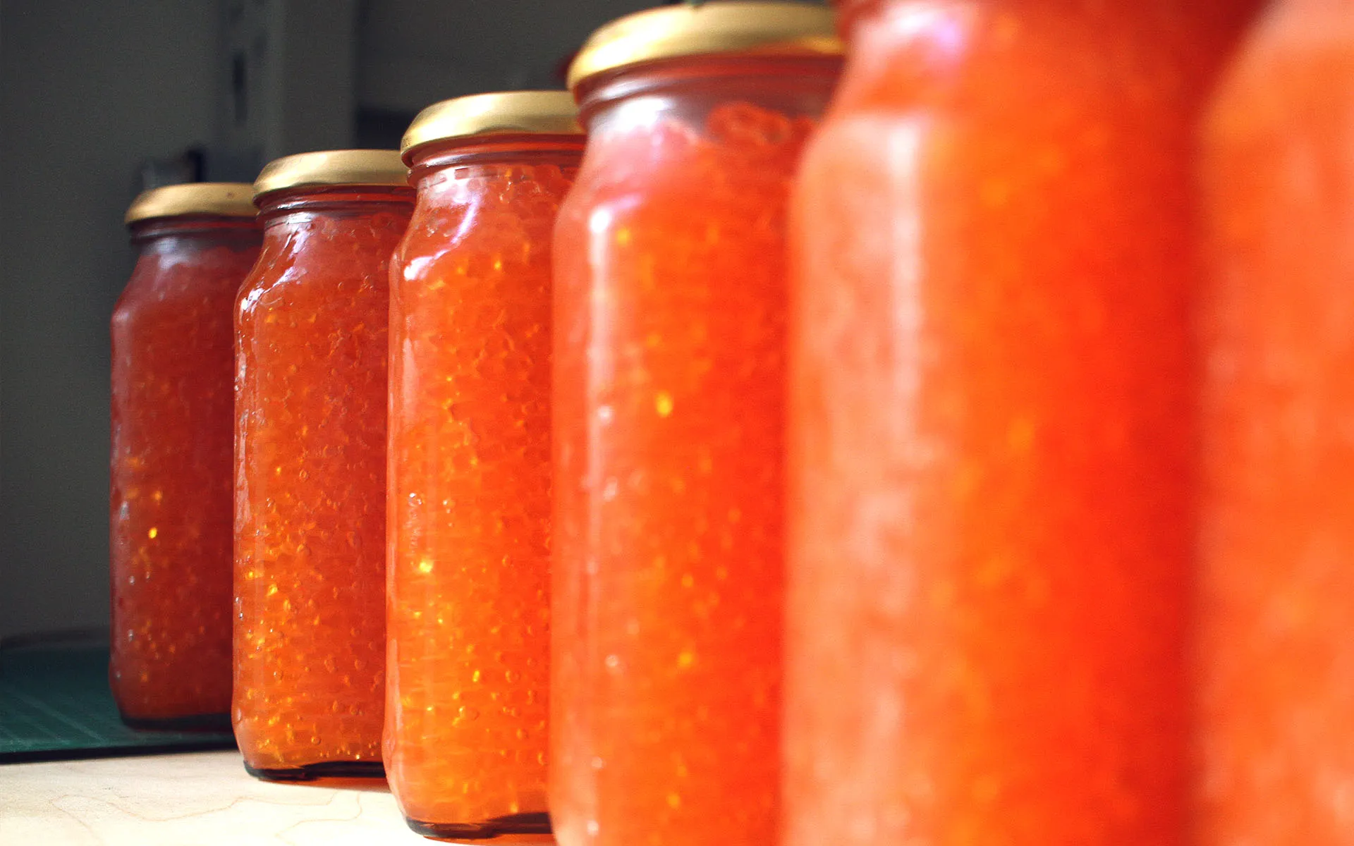 Six jars of caviar ready for storage.